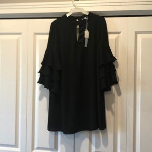 Black keyhole dress with ruffle sleeves.